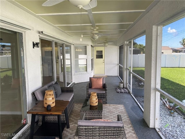 sunroom with ceiling fan