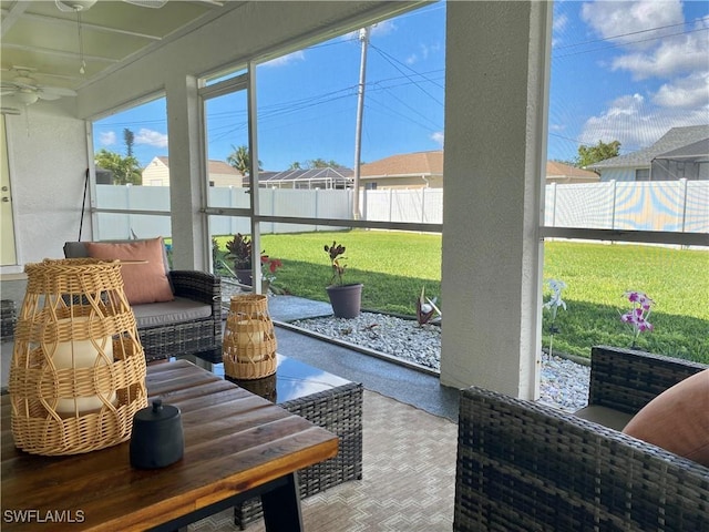 sunroom / solarium with ceiling fan