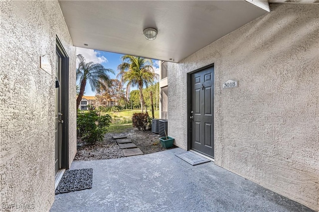 property entrance with central AC unit