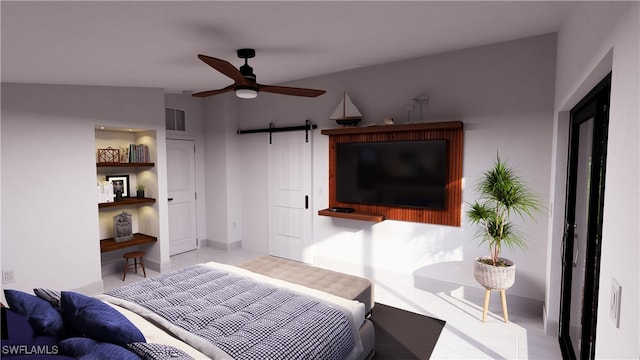 bedroom with visible vents and a barn door