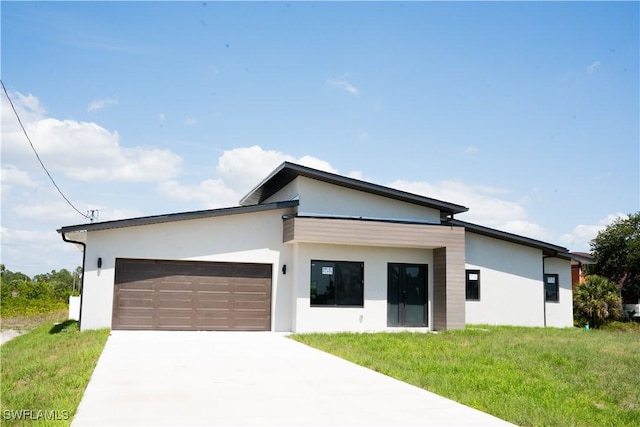 919 Columbus Blvd S, Lehigh Acres, FL 33974 - contemporary house with stucco siding, a garage, driveway, and a front yard