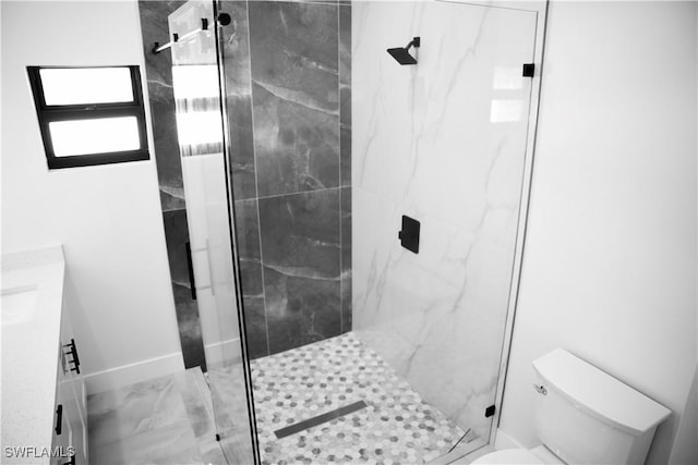 919 Columbus Blvd S, Lehigh Acres, FL 33974 - full bathroom with toilet, a marble finish shower, baseboards, vanity, and marble look tiles