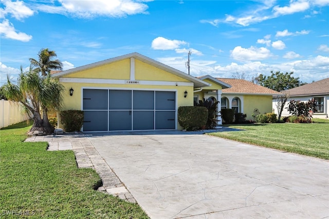 single story home with a garage, fence, concrete driveway, stucco siding, and a front lawn