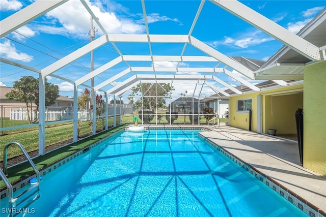 view of swimming pool with a lawn, a fenced in pool, a patio, a lanai, and fence