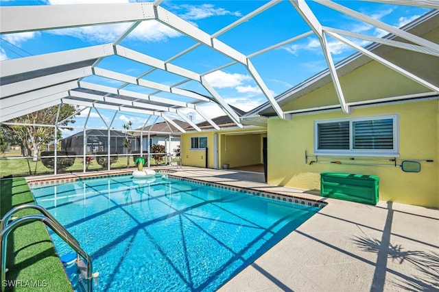 outdoor pool featuring a lanai and a patio