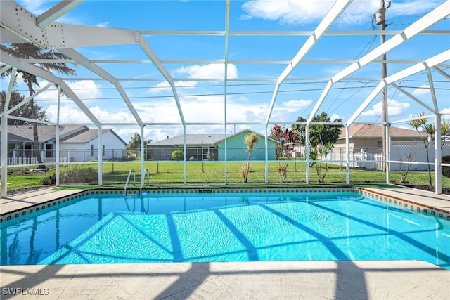 view of pool featuring a lanai, a residential view, and a fenced in pool