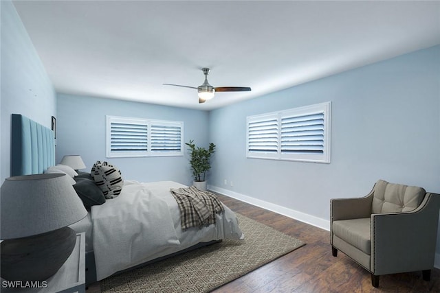 bedroom featuring dark wood-style floors, ceiling fan, and baseboards