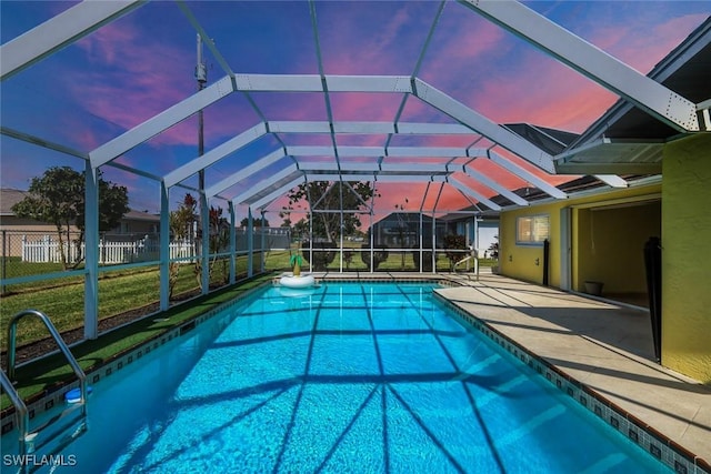 view of swimming pool featuring a lanai, a patio area, fence, and a fenced in pool