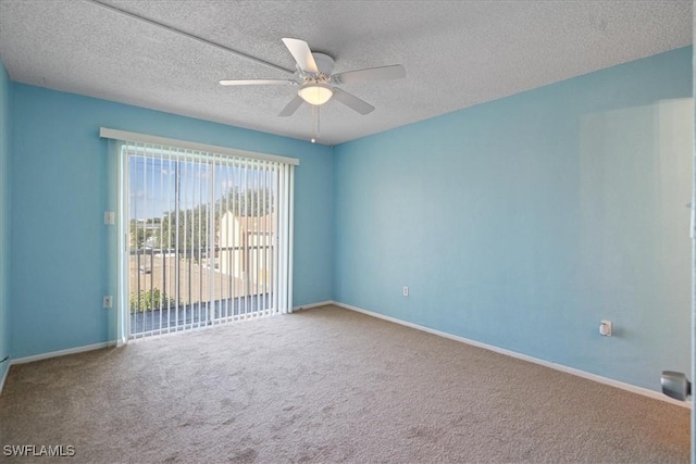 carpeted empty room with a textured ceiling and ceiling fan