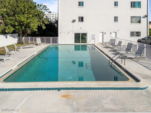 view of swimming pool with a patio