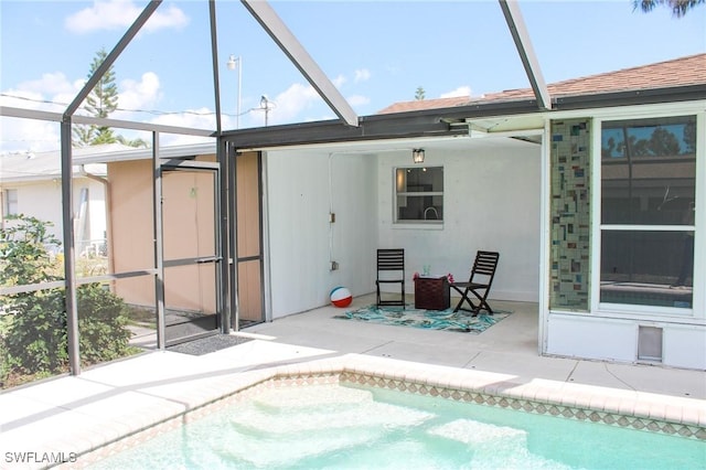 back of property featuring a patio and a lanai