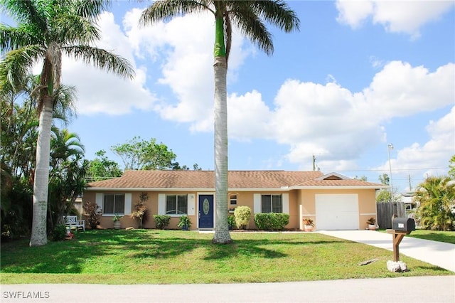 ranch-style home featuring a garage and a front lawn