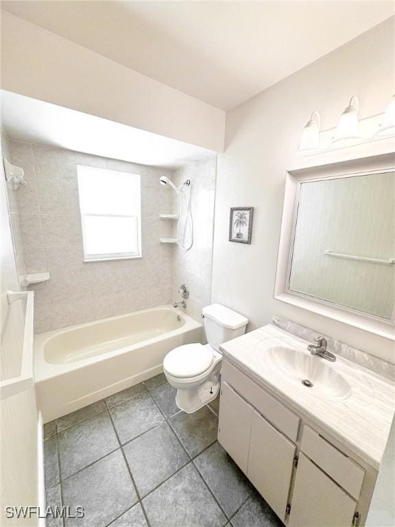 full bathroom with tiled shower / bath combo, vanity, tile patterned flooring, and toilet