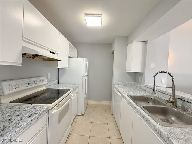 kitchen featuring white cabinetry, sink, light tile patterned floors, and white appliances