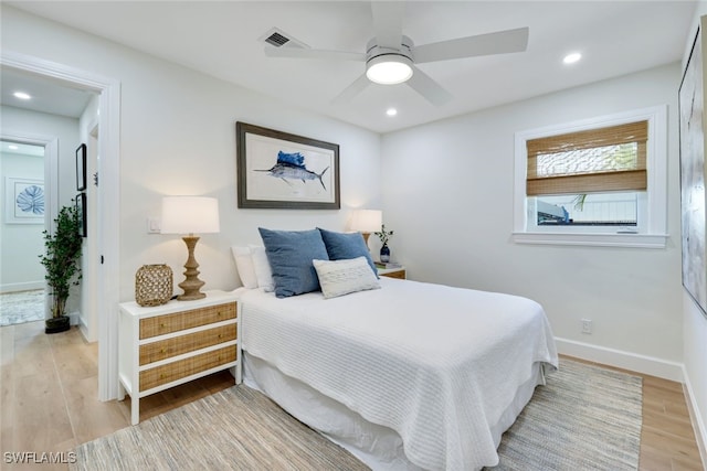 bedroom featuring ceiling fan and light hardwood / wood-style flooring