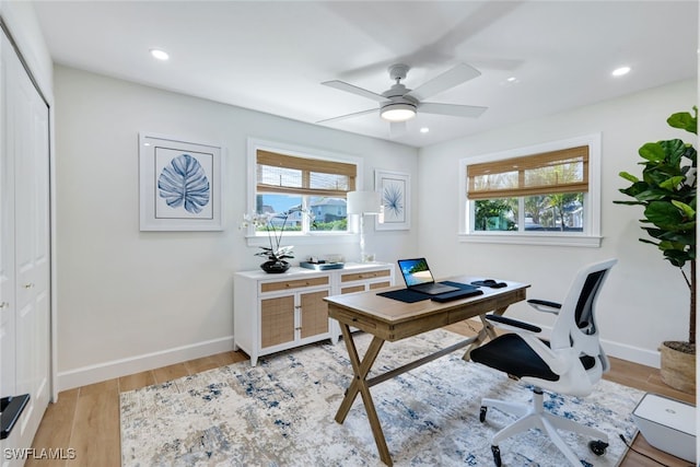 home office featuring ceiling fan and light wood-type flooring