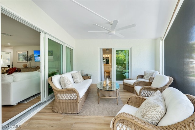 sunroom / solarium with ceiling fan