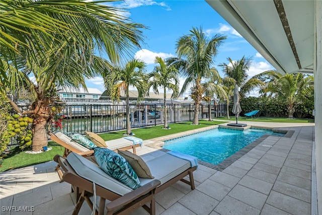 view of pool featuring a patio and a water view