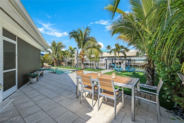 view of patio / terrace with a fenced in pool