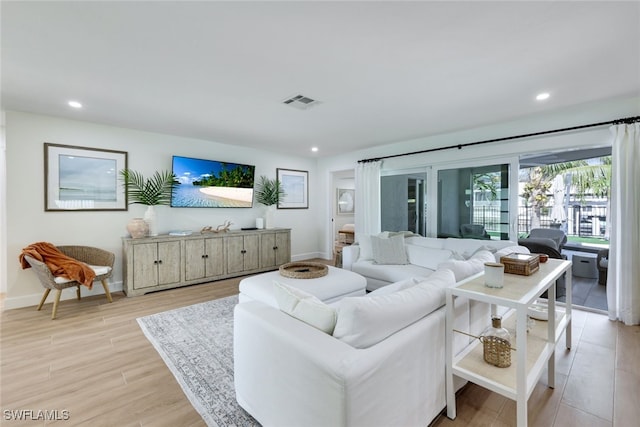 living room with light hardwood / wood-style floors