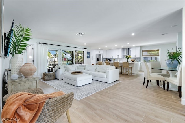 living room with light hardwood / wood-style flooring