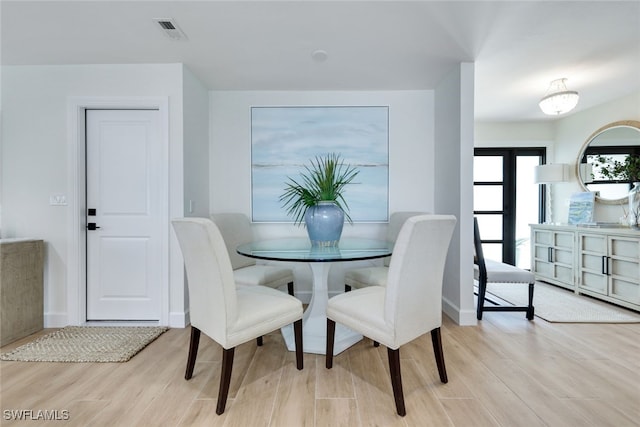 dining area with light wood-type flooring