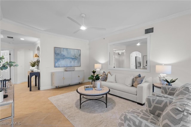 living room with ornamental molding, ceiling fan, and light tile patterned flooring