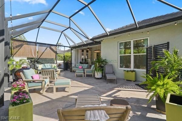 view of patio / terrace featuring a lanai and an outdoor living space