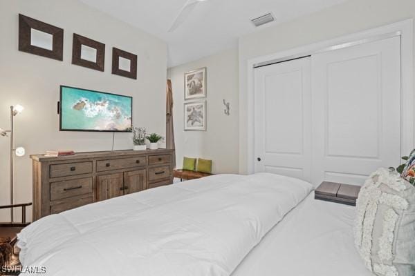 bedroom with visible vents and a closet