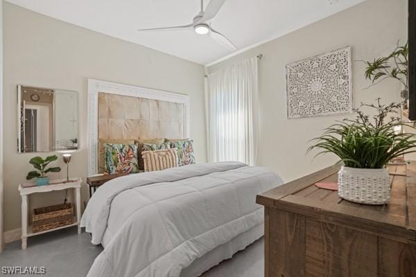 bedroom with finished concrete floors and ceiling fan