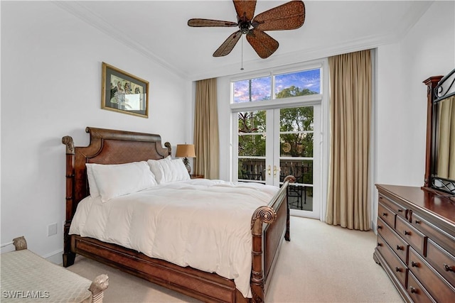 carpeted bedroom with crown molding, access to outside, ceiling fan, and french doors