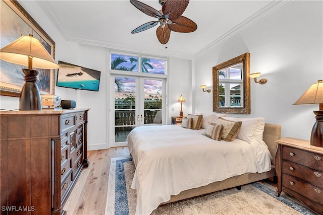 bedroom featuring multiple windows, ornamental molding, access to exterior, and light hardwood / wood-style flooring