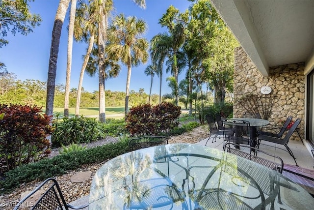 view of patio featuring outdoor dining area