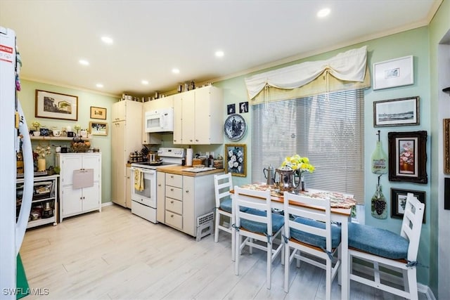 kitchen featuring crown molding, recessed lighting, light wood-style floors, white appliances, and white cabinetry