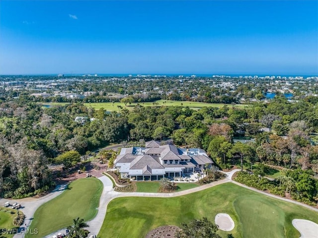 birds eye view of property with golf course view