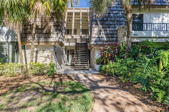 view of property featuring stairs