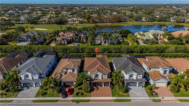 aerial view with a residential view and a water view