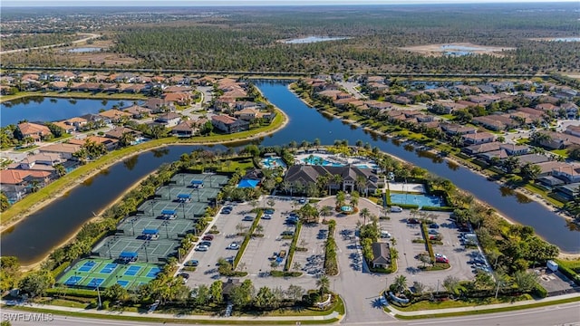 bird's eye view with a residential view and a water view