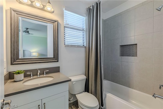 bathroom with shower / tub combo with curtain, vanity, and toilet