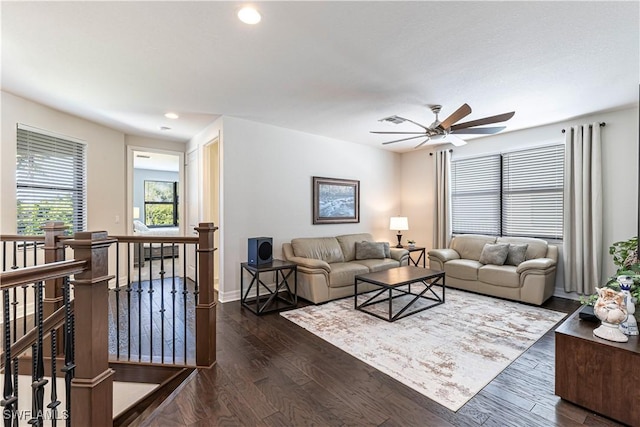 living room with baseboards, visible vents, dark wood-style floors, ceiling fan, and recessed lighting