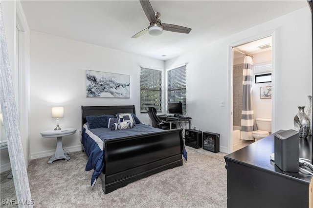 carpeted bedroom with baseboards, a ceiling fan, and connected bathroom