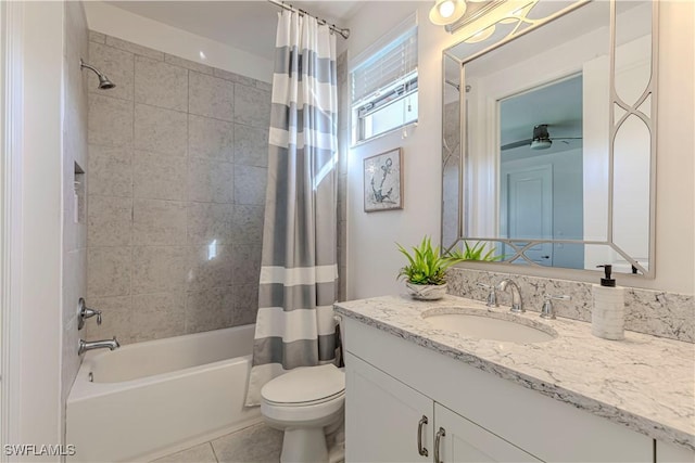 full bath with tile patterned floors, vanity, toilet, and shower / bath combo with shower curtain