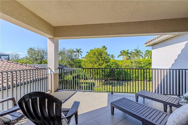 view of patio featuring a balcony