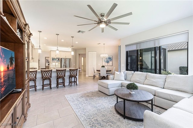 living room with recessed lighting, visible vents, ceiling fan, and light tile patterned floors