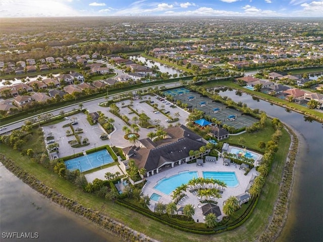 aerial view featuring a residential view and a water view