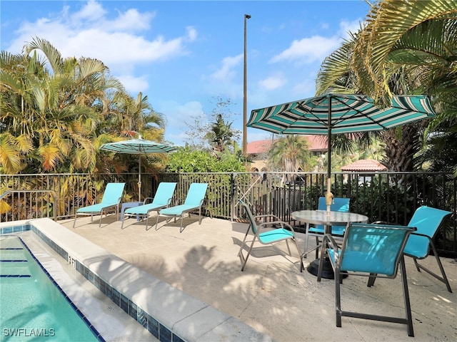 9831 Alabama St Unit 5, Bonita Springs, FL 34135 - view of patio / terrace featuring a community pool