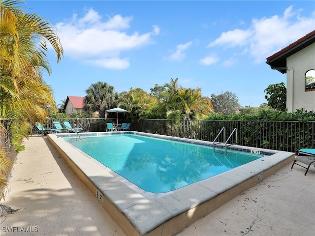9831 Alabama St Unit 5, Bonita Springs, FL 34135 - view of swimming pool featuring a patio