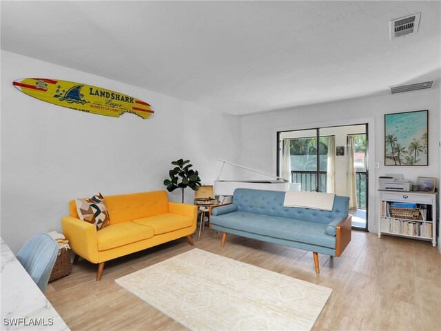 9831 Alabama St Unit 5, Bonita Springs, FL 34135 - living room featuring light hardwood / wood-style floors