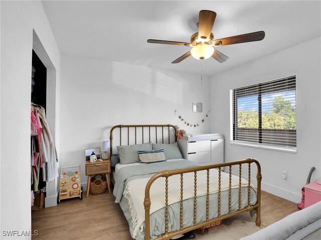 9831 Alabama St Unit 5, Bonita Springs, FL 34135 - bedroom featuring ceiling fan and light wood-type flooring