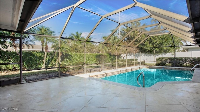 view of pool with a lanai and a patio